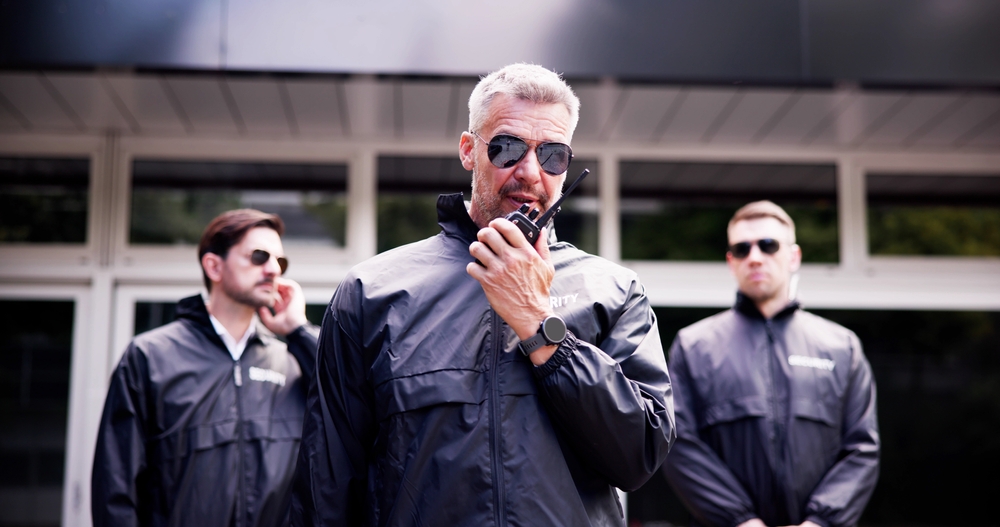 Experienced,Security,Guard,With,A,Team,Of,Bodyguards,Keeping,A