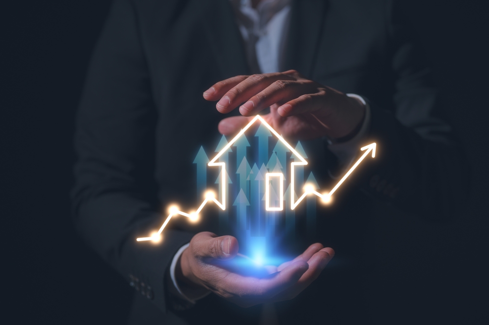 Real,Estate,Investment,Businessman,Holding,Building,Or,House,Chart,Graph